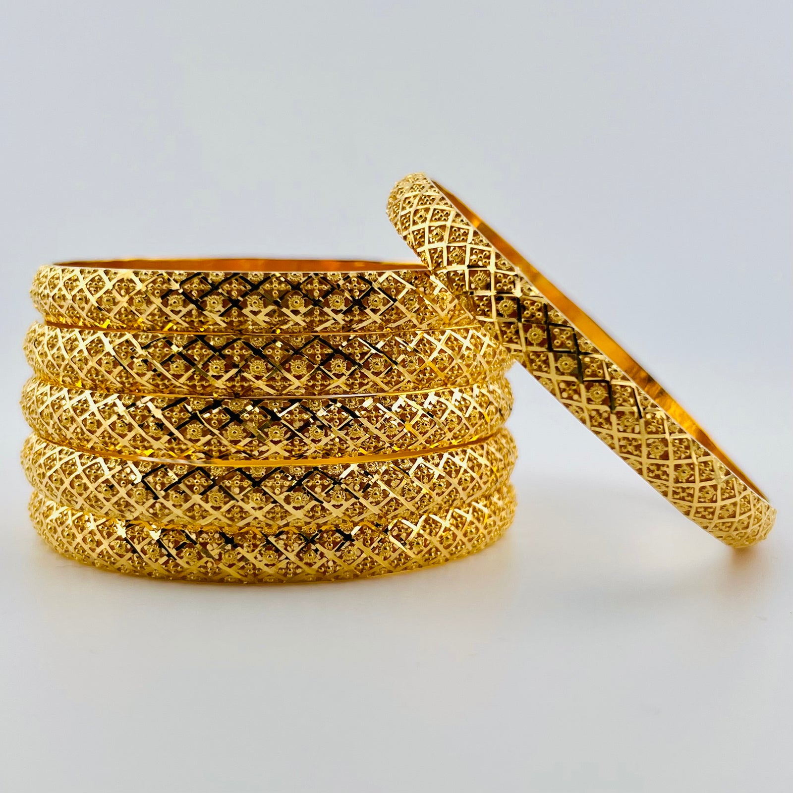 FIVE GOLD ROPE TWIST BANGLE BRACELETS BY CARTIER, CIRCA 1950 – Siegelson  Jewelry, image size:1600x1600